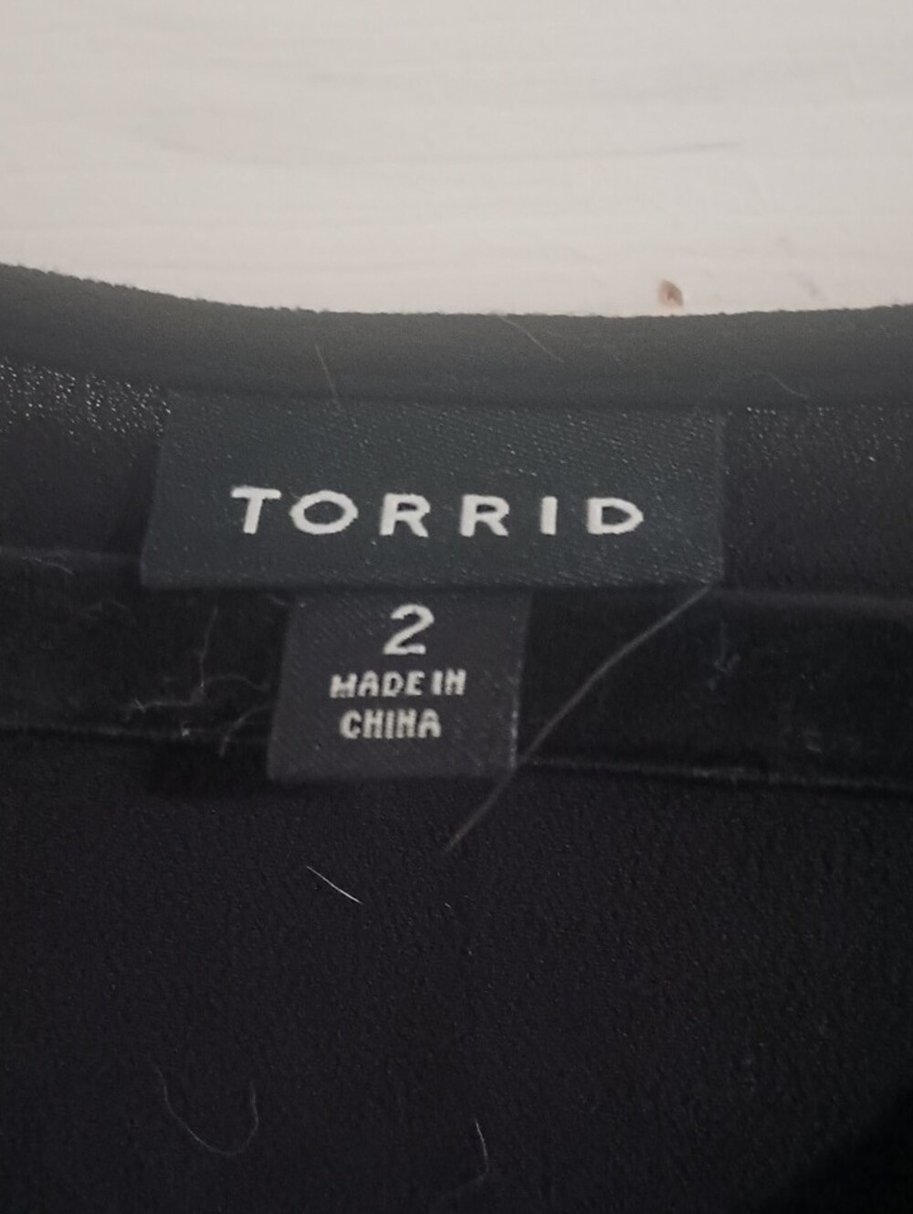 torrid Black Flowing Peplum Long-Sleeve Top - Picture 2 of 8